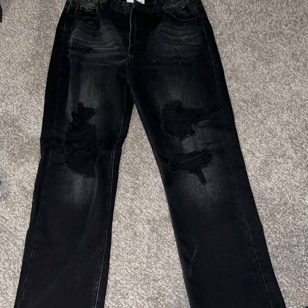 Black bootcut jeans with rips